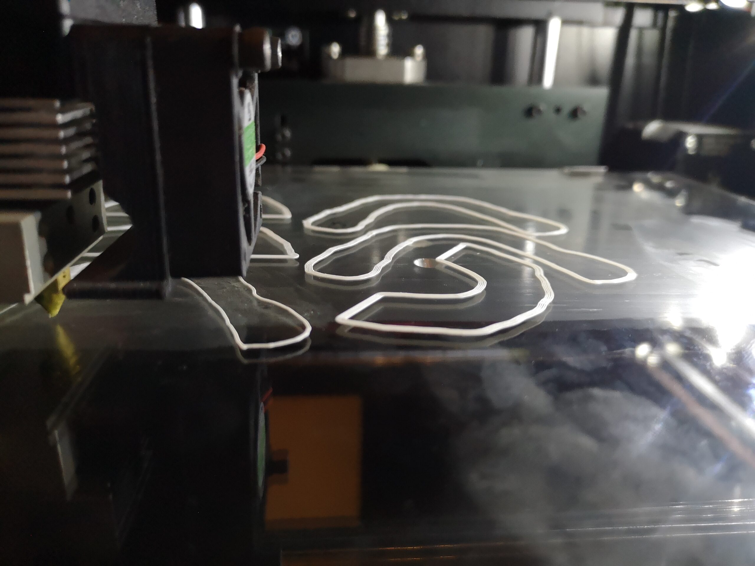 Our 3D printer lays down the first layer of the object.