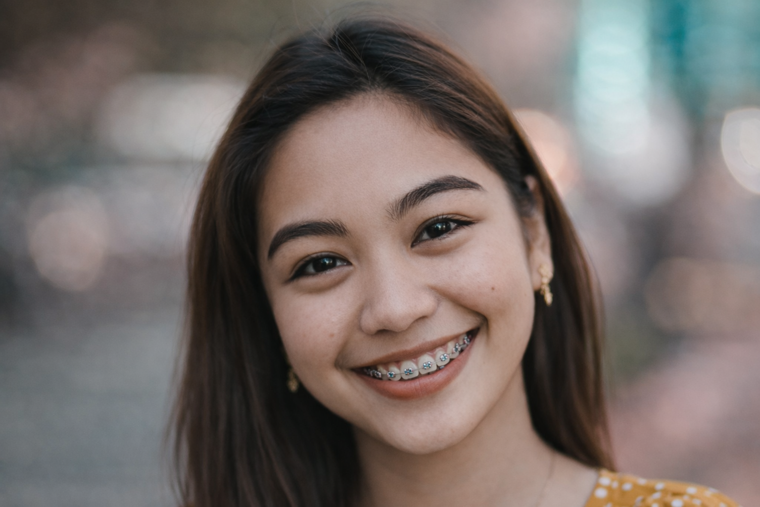 Young woman from Manila, Philippines, with braces, smiling